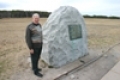 Gerard Bollee beside the stone marking the take off point of the 1st flights accomplished by the Wright brothers on 17th December 1903 at 10.35 AM  